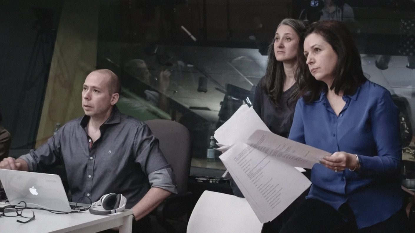 Chris Tolley and Laura Mullin working through a script with a writer.