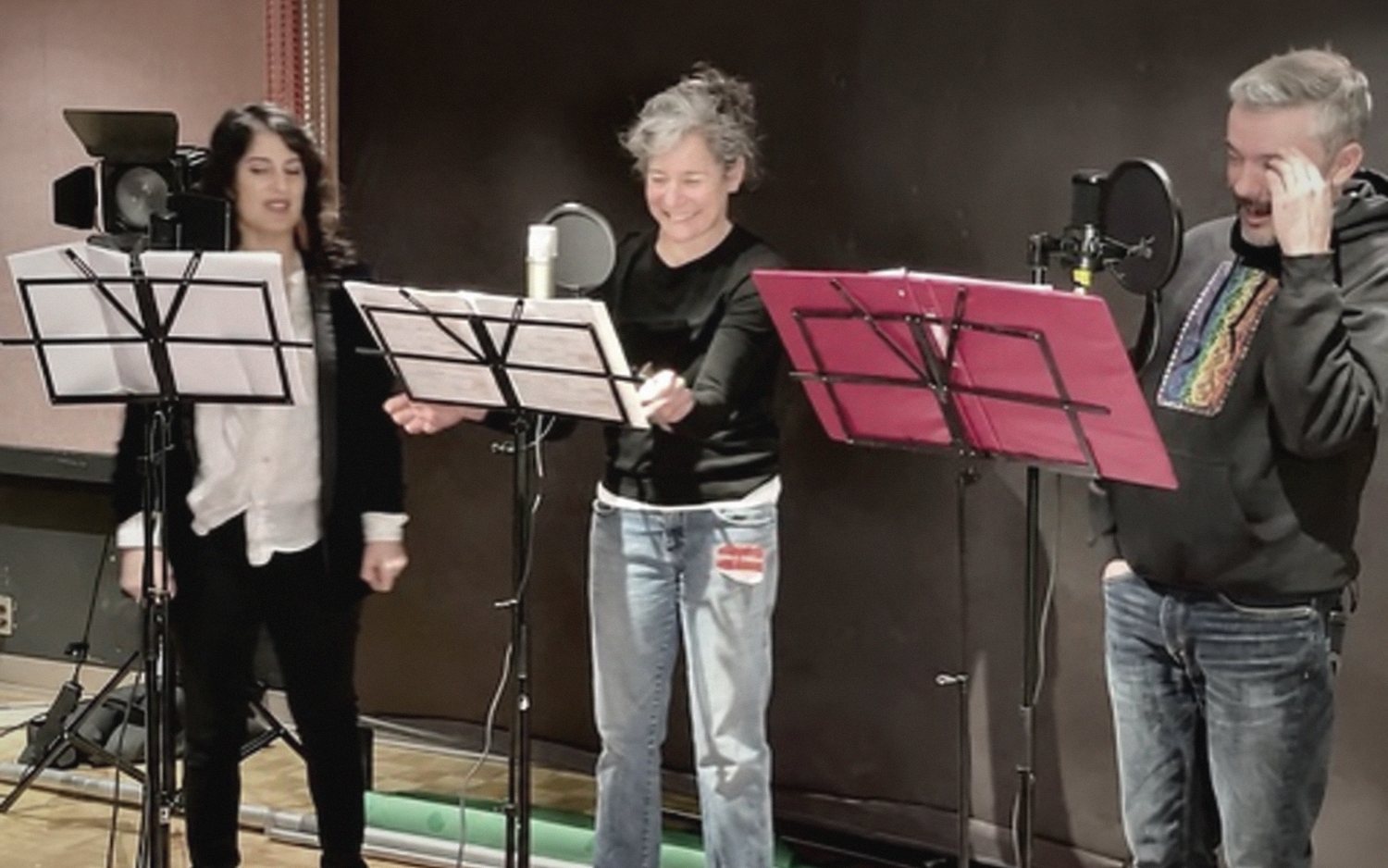 Three actors at music stands recording a PlayME session.